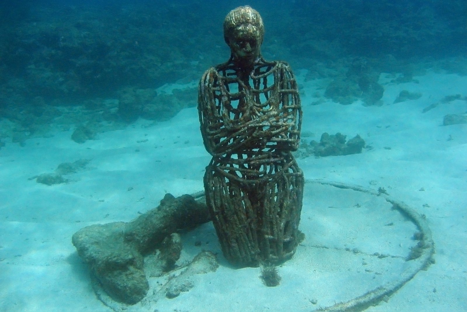 Sienna, a seated figure sculpture in the Molinière Bay Underwater Sculpture Park, Grenada